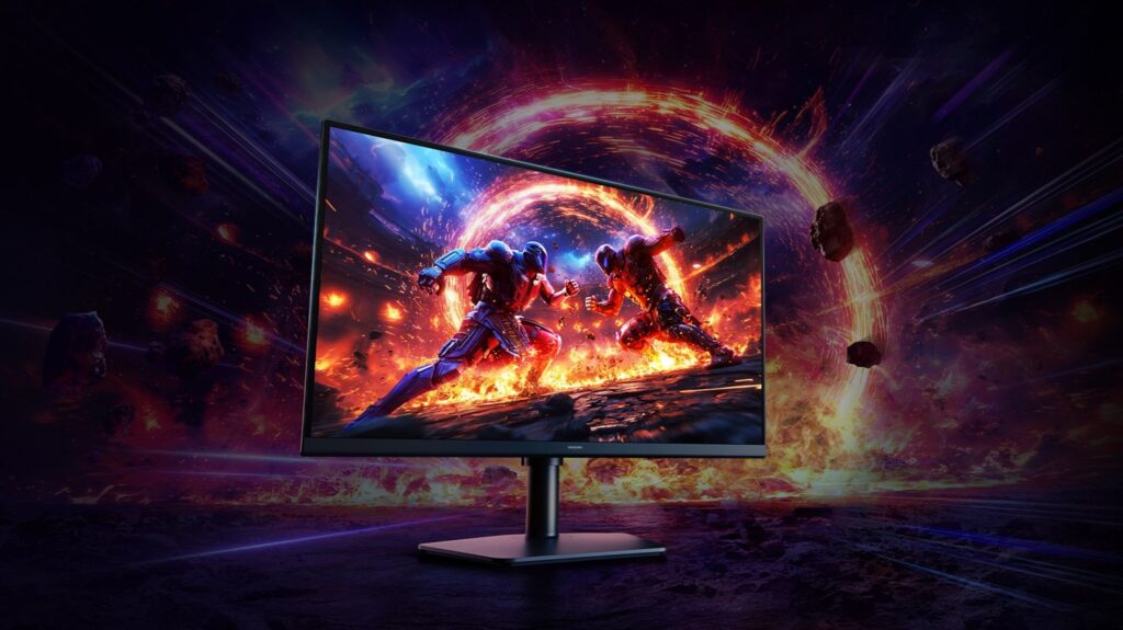 Samsung Odyssey G60H_02 - lab-kuzniewski.pl - Testy laptopów, recenzje i porównania Samsung computer monitor on a stand showing a sci-fi action game with two armored fighters in a fiery portal battlefield.
