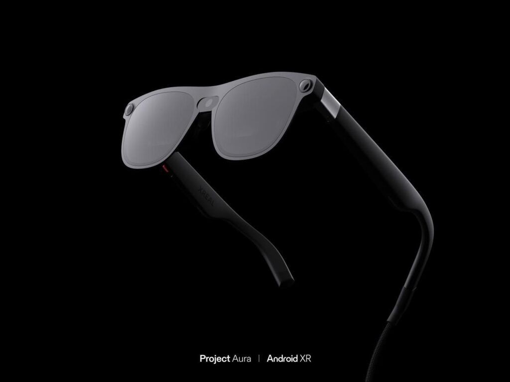 Sleek black AR/XR glasses called Project Aura set against a black background, with 'Project Aura | Android XR' text at the bottom.